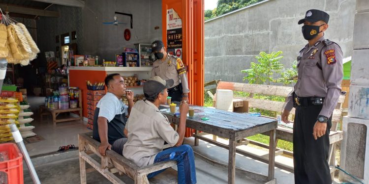 Polsubsektor Pelalawan Lakukan Pendisiplinan Prokes di Desa Lalang Kabung