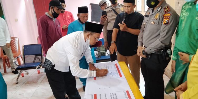 Kapolsek Kuala Kampar Ikuti Rapat Persiapan dan Deklasi Damai Calon Kepala Desa