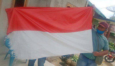 Kibarkan Bendera Sang Saka Merah Putih keadaan Robek, APH Diminta Berikan Sangsi Tegas kepada Kepalo Tiyuh