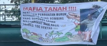 Spanduk Dugaan Konflik Lahan Tangkap Mafia Tanah Beredar di Pekanbaru