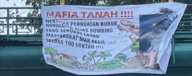 Spanduk Dugaan Konflik Lahan Tangkap Mafia Tanah Beredar di Pekanbaru